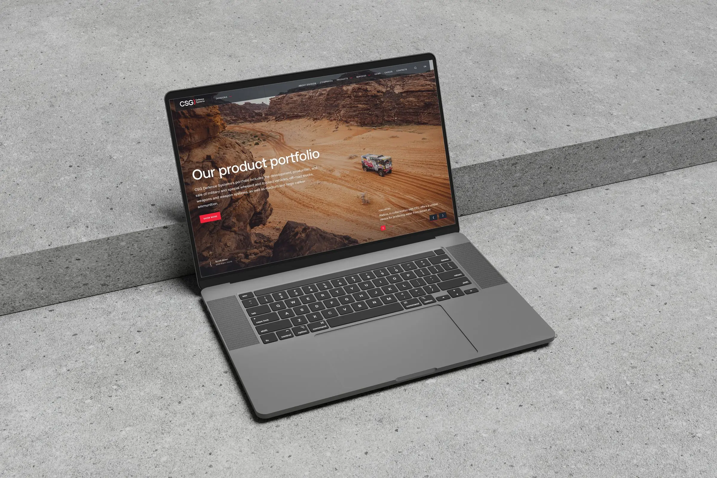 Laptop showing the CSG Defence division site, 'Our product portfolio'