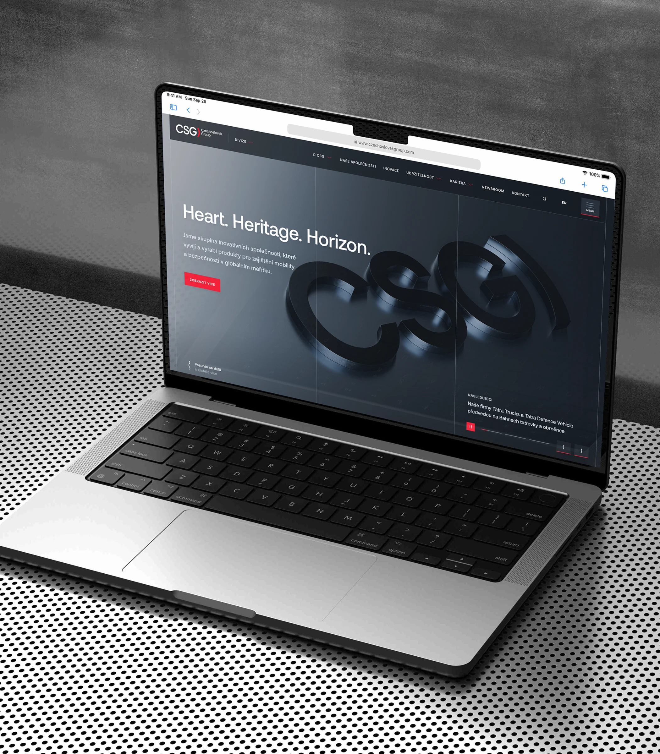 Laptop showing the CSG homepage 'Heart. Heritage. Horizon.' with the 3D logo