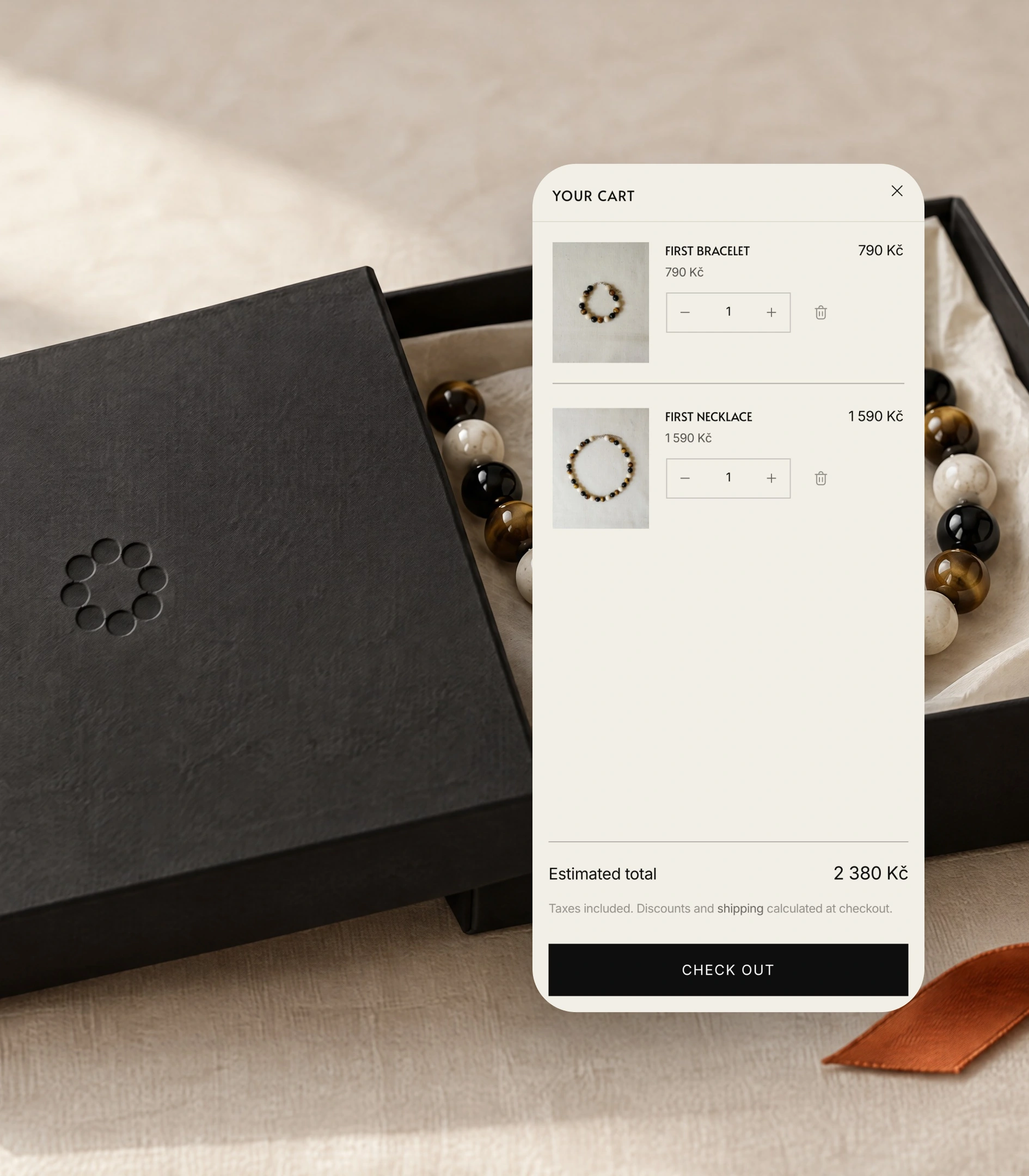 GRAIN cart drawer on a phone over a black box with the debossed bead symbol