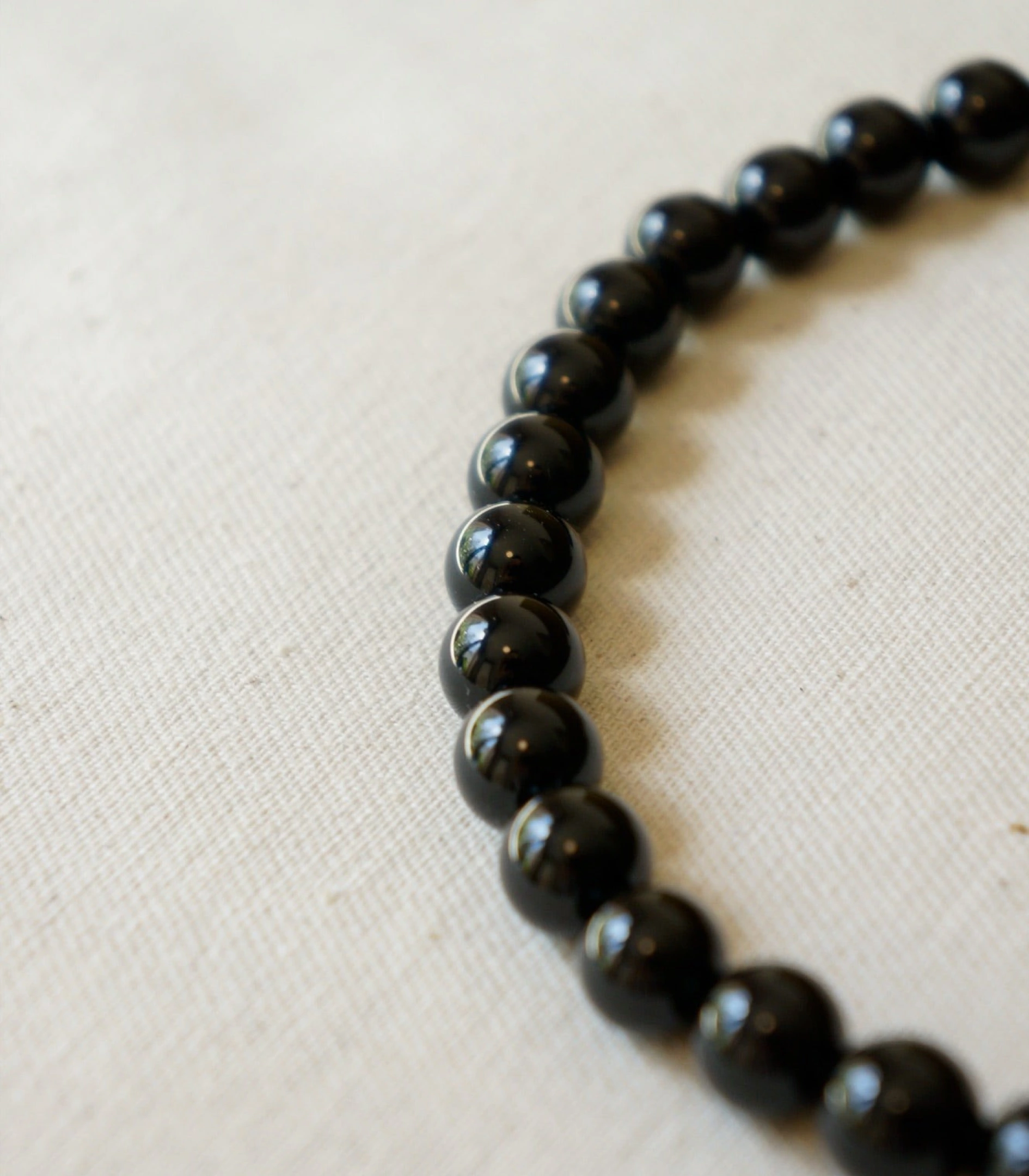 Close-up of the Intensity necklace in black onyx