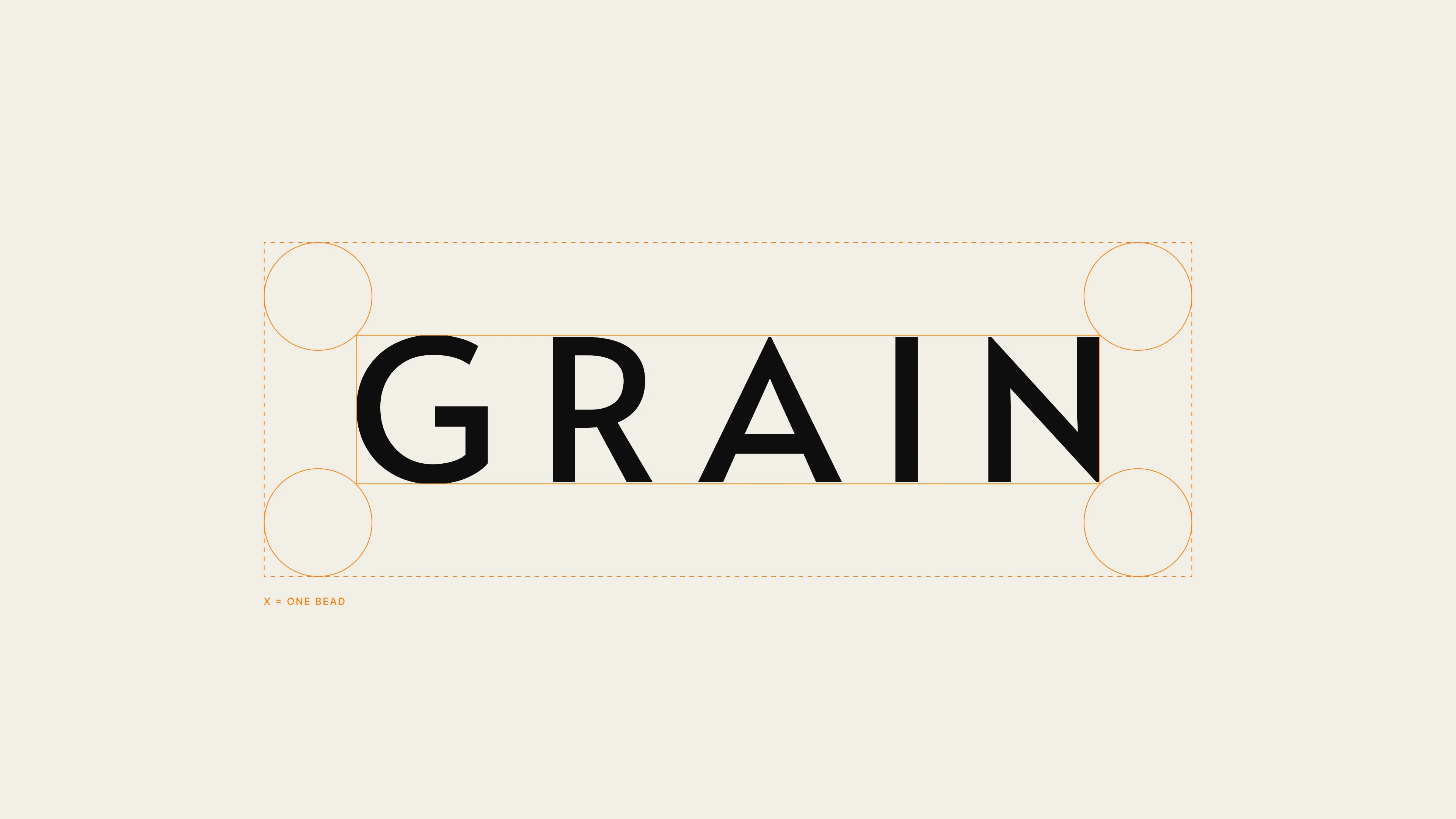 GRAIN wordmark with its clear space marked by one bead at each corner