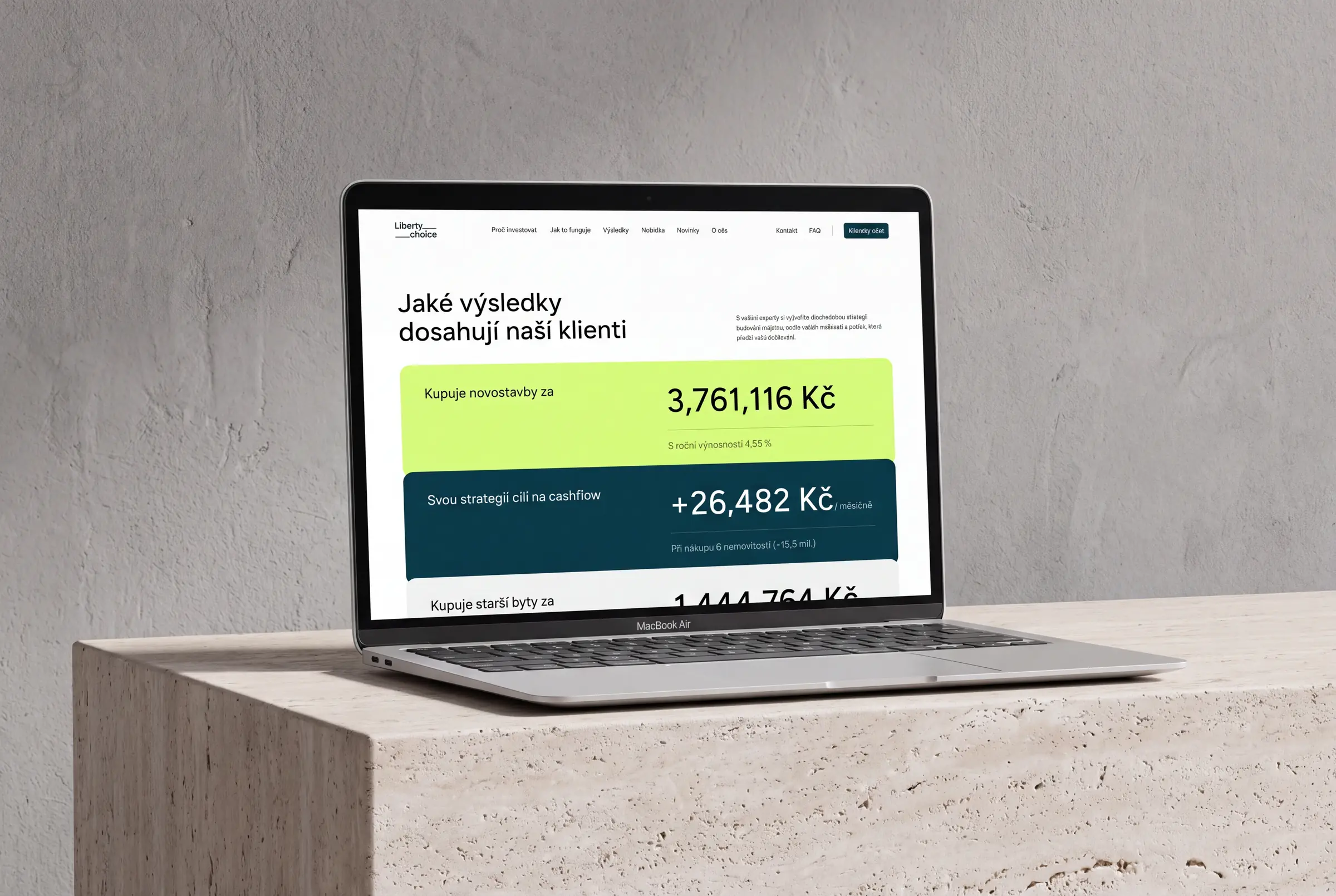 Laptop on a stone block showing Liberty Choice client results on the website