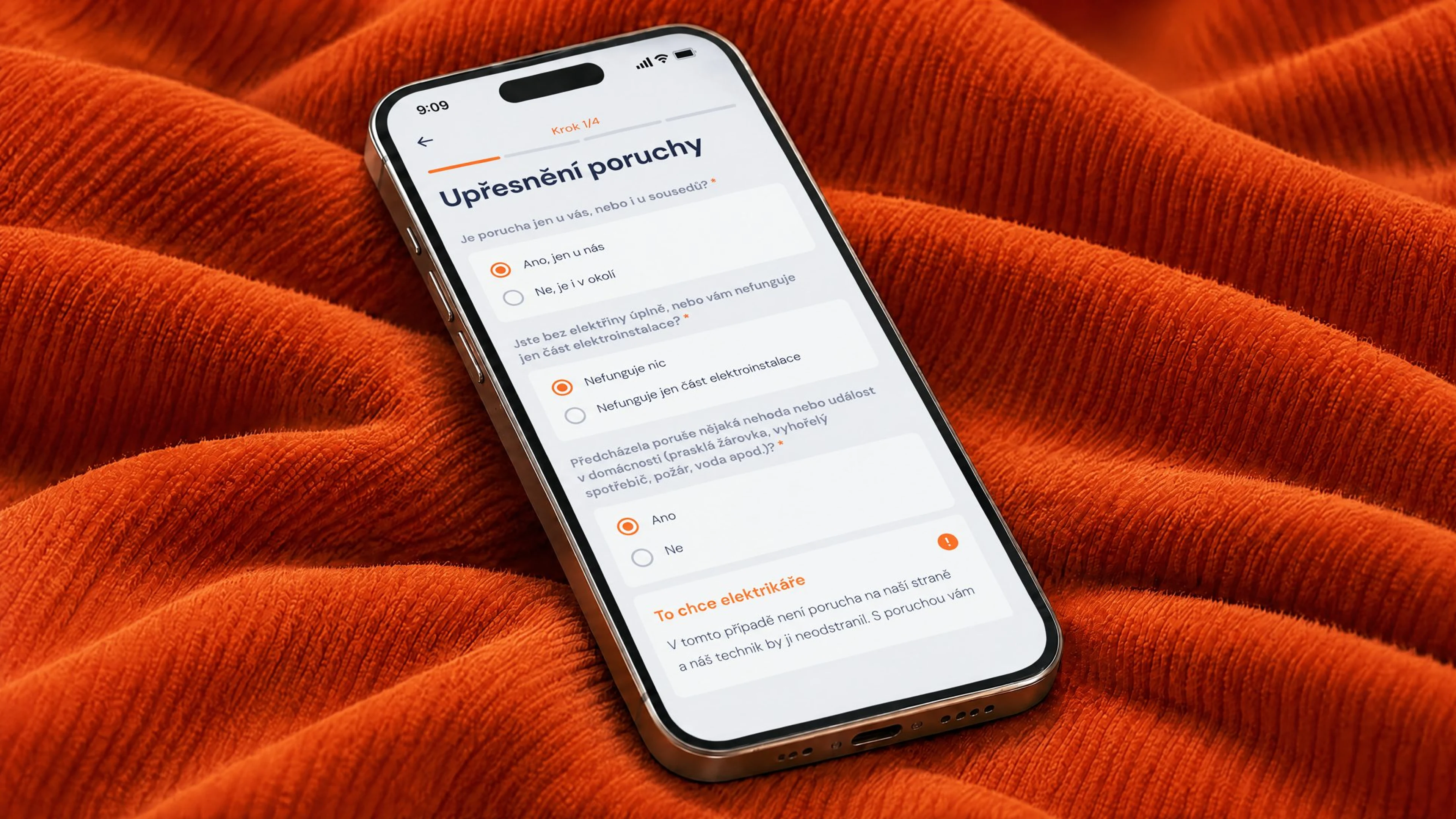 Phone on orange corduroy showing the first step of the fault report