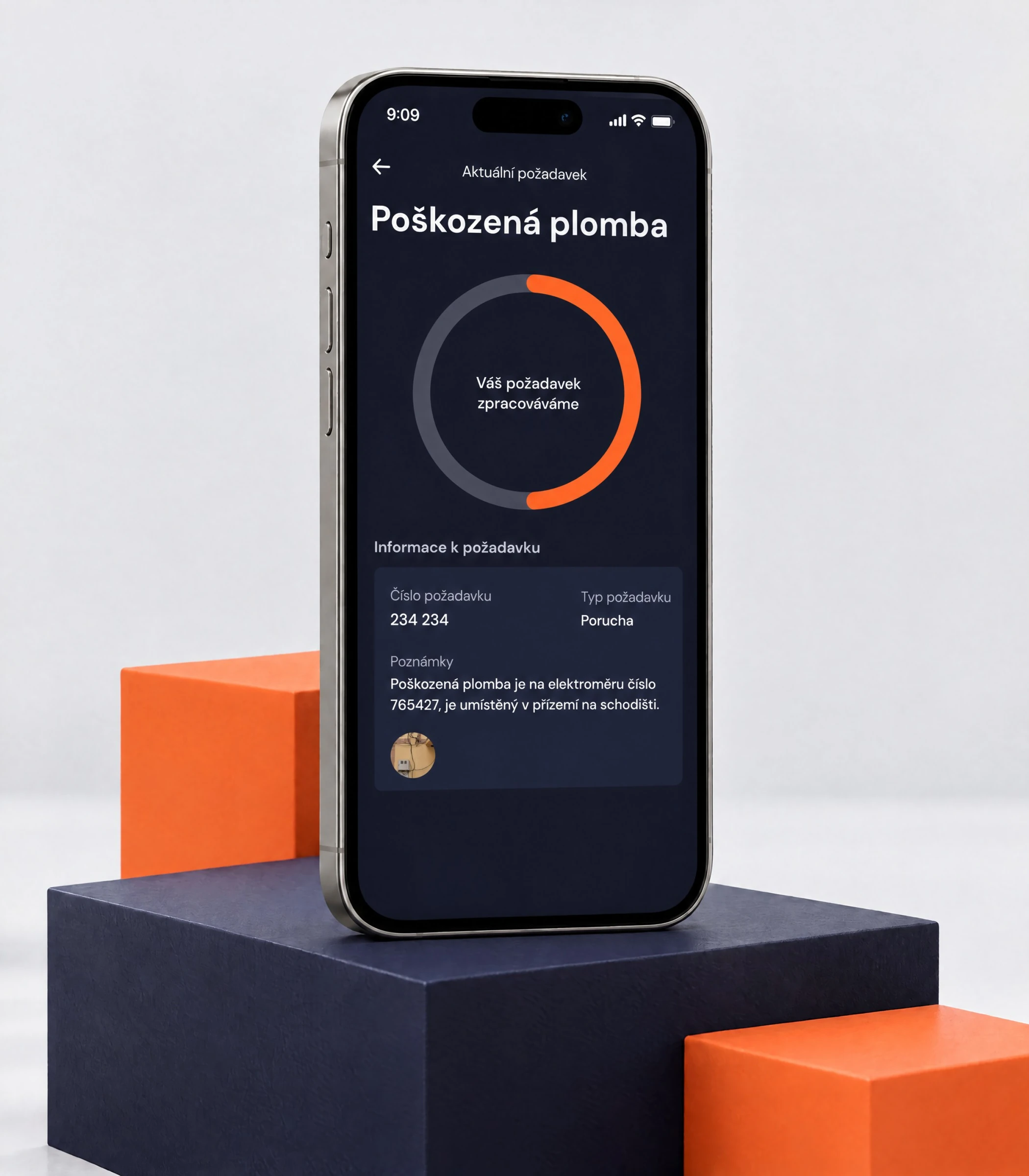 Phone on navy and orange blocks showing a request status with an orange progress ring