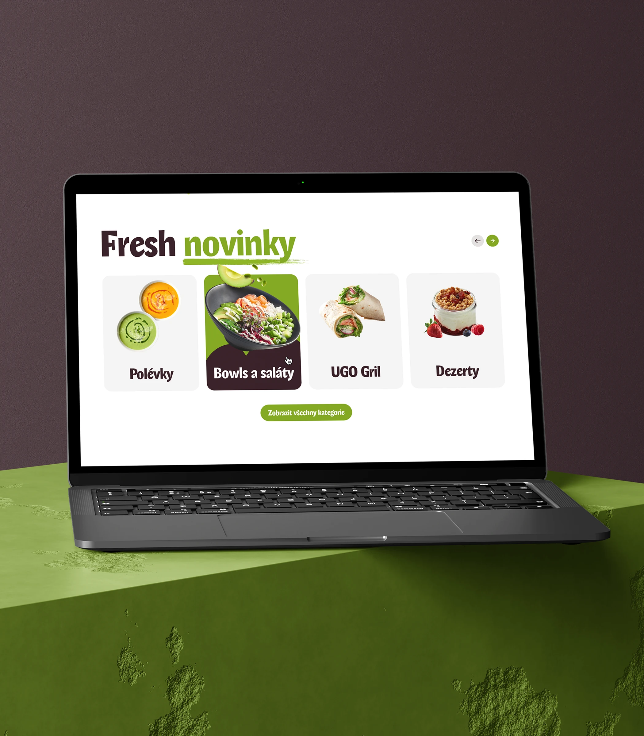 Laptop showing the UGO 'Fresh novinky' section with soup, bowl, grill and dessert categories